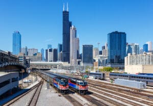 Chicago, United States - May 3, 2023: Skyline with METRA commuter rail trains public transport near Union Station in Chicago, United States.