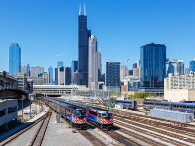 Chicago, United States - May 3, 2023: Skyline with METRA commuter rail trains public transport near Union Station in Chicago, United States.
